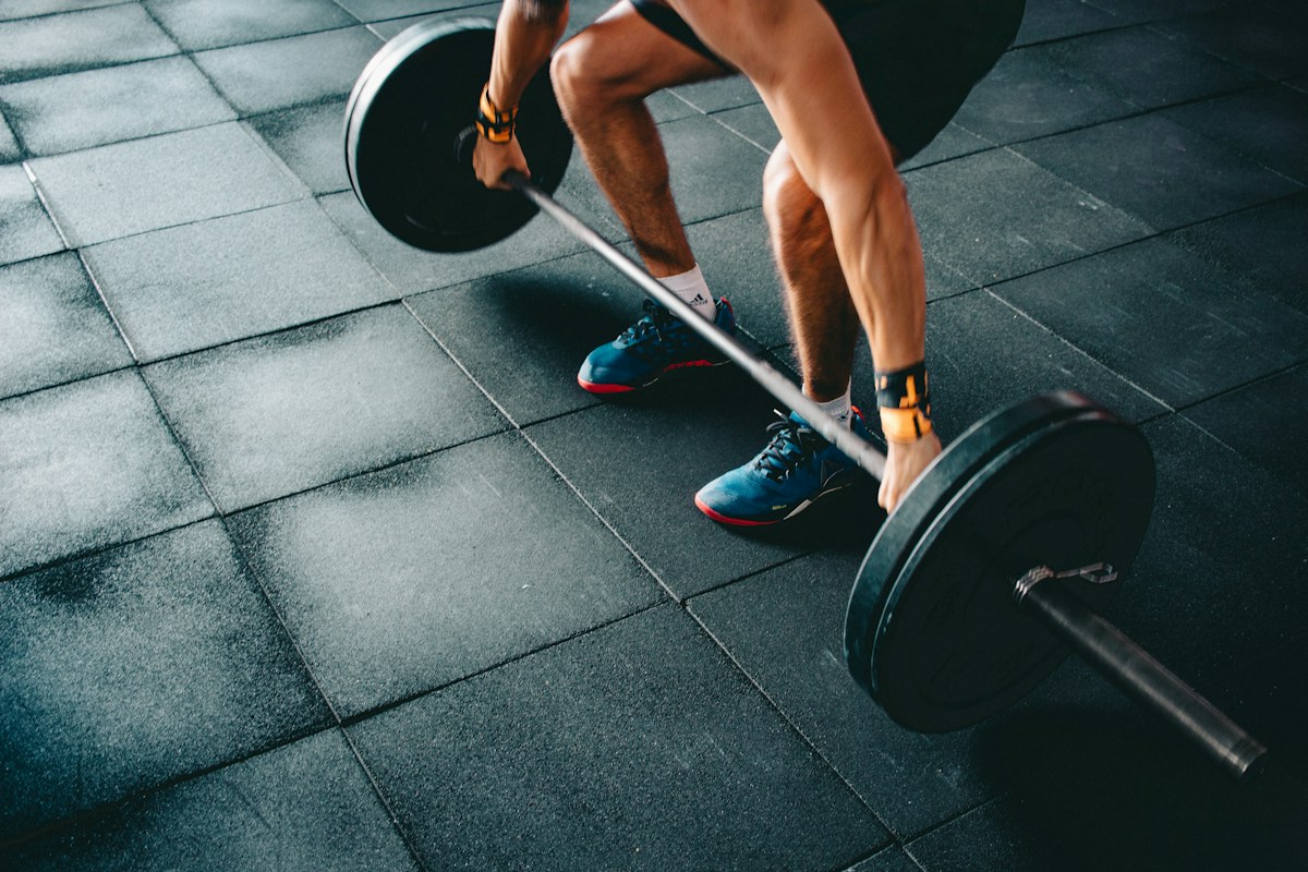 Athlete preparing a barbell for strength training